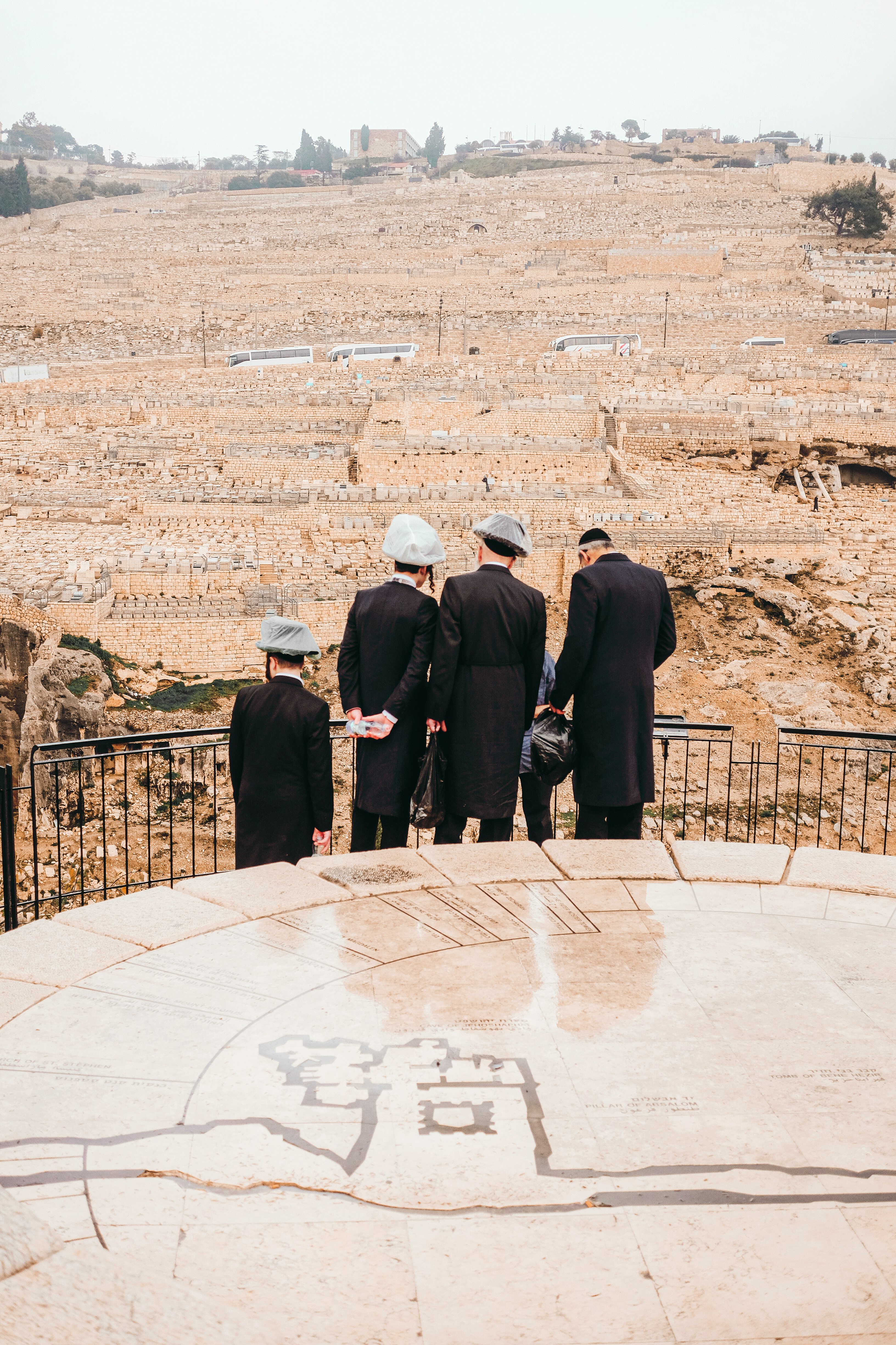 people standing on brown field during daytime